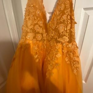 Orange floor length ball gown prom
